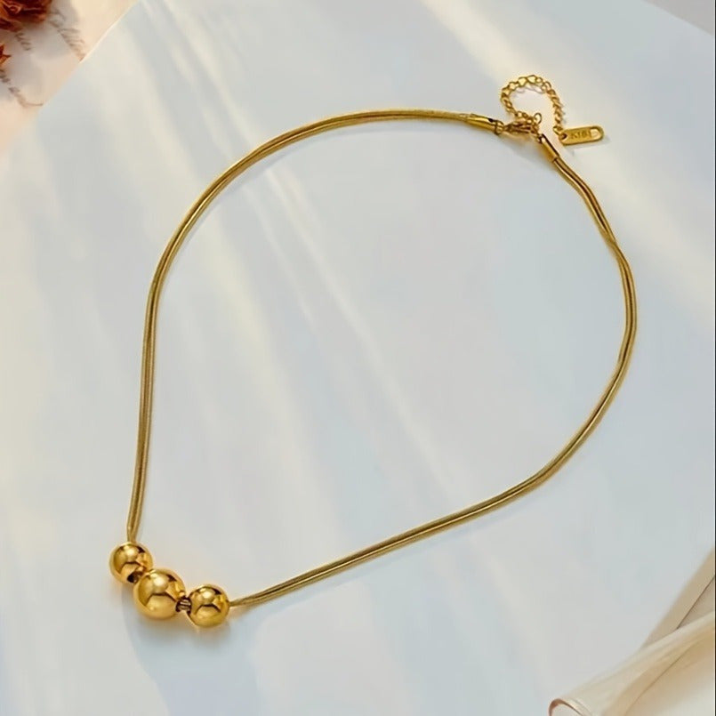 Elegant Golden Spherical Pendant Necklace