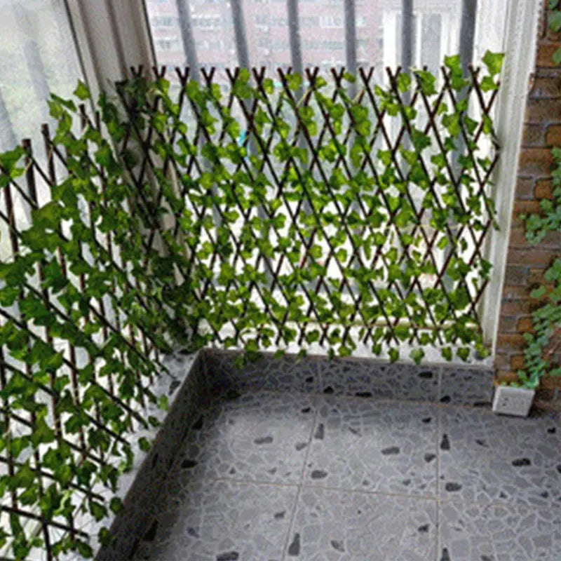Telescopic Simulation Fence with Fake Flowers and Green Leaves