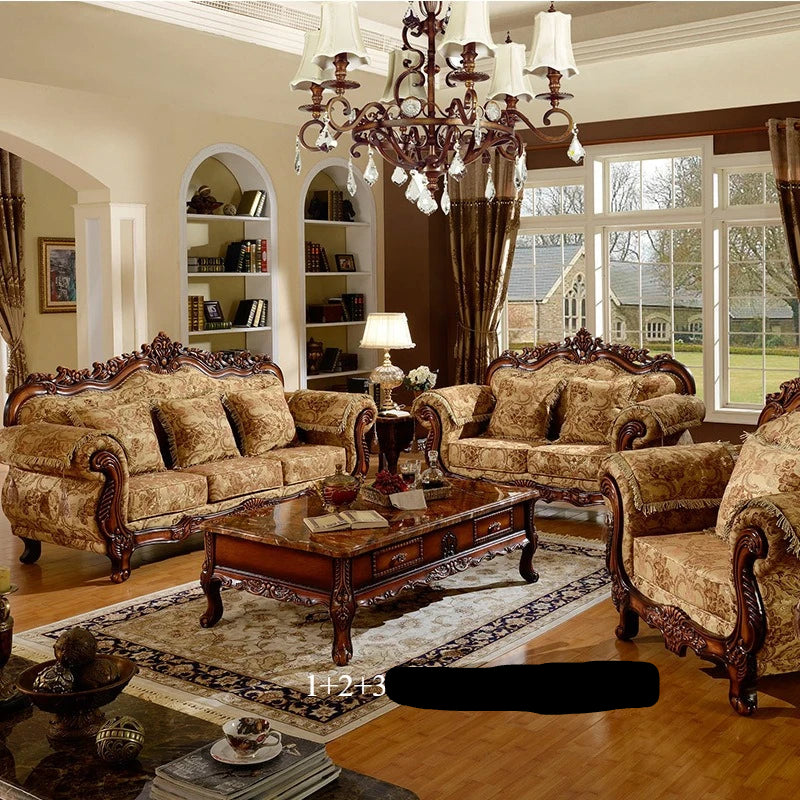 Luxurious living room with ornate furniture and a chandelier.