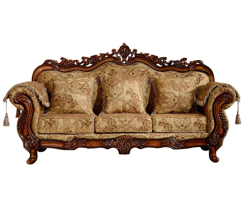 Decorative sofa with intricate woodwork and patterned fabric on a white background